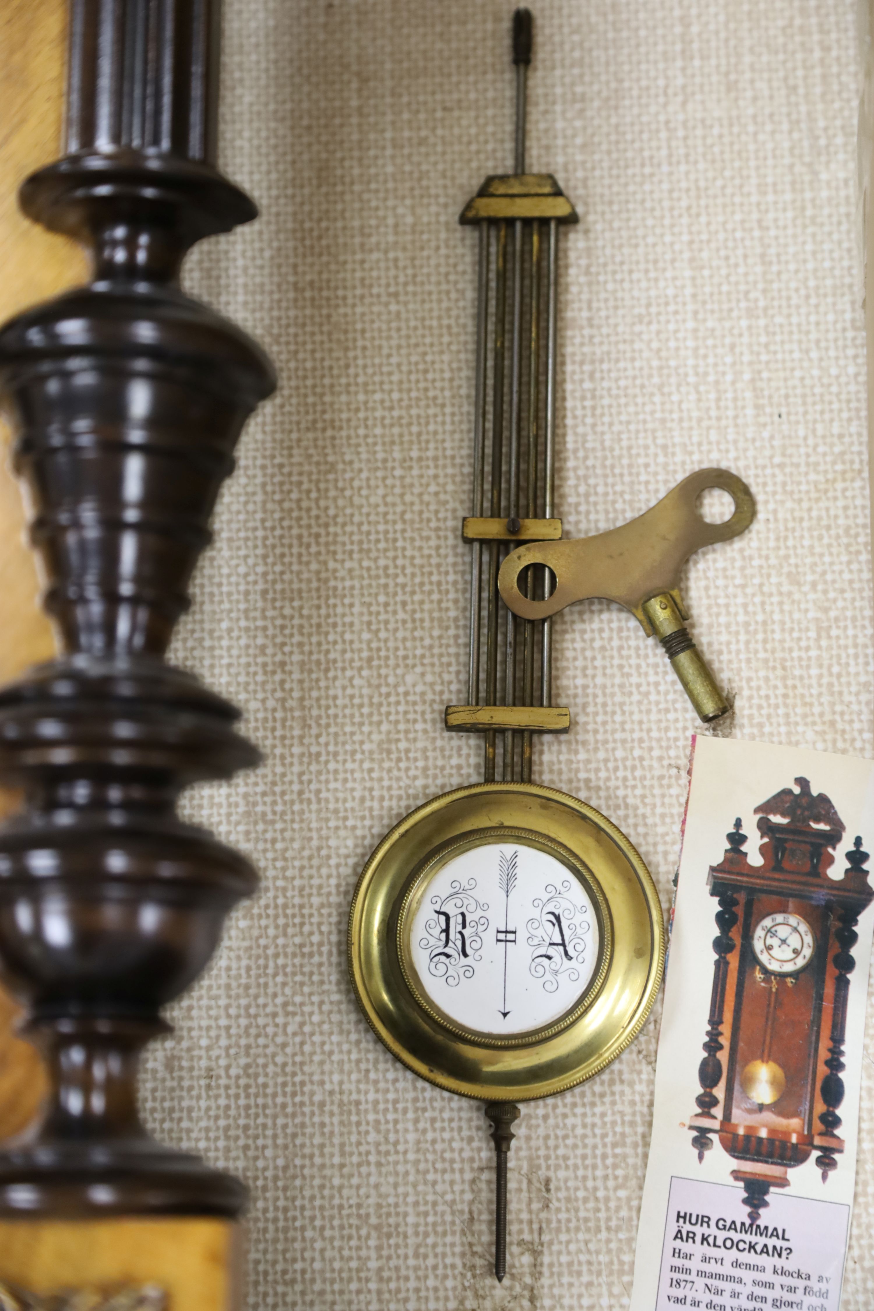 A 19th century German walnut wall clock, length 102cm